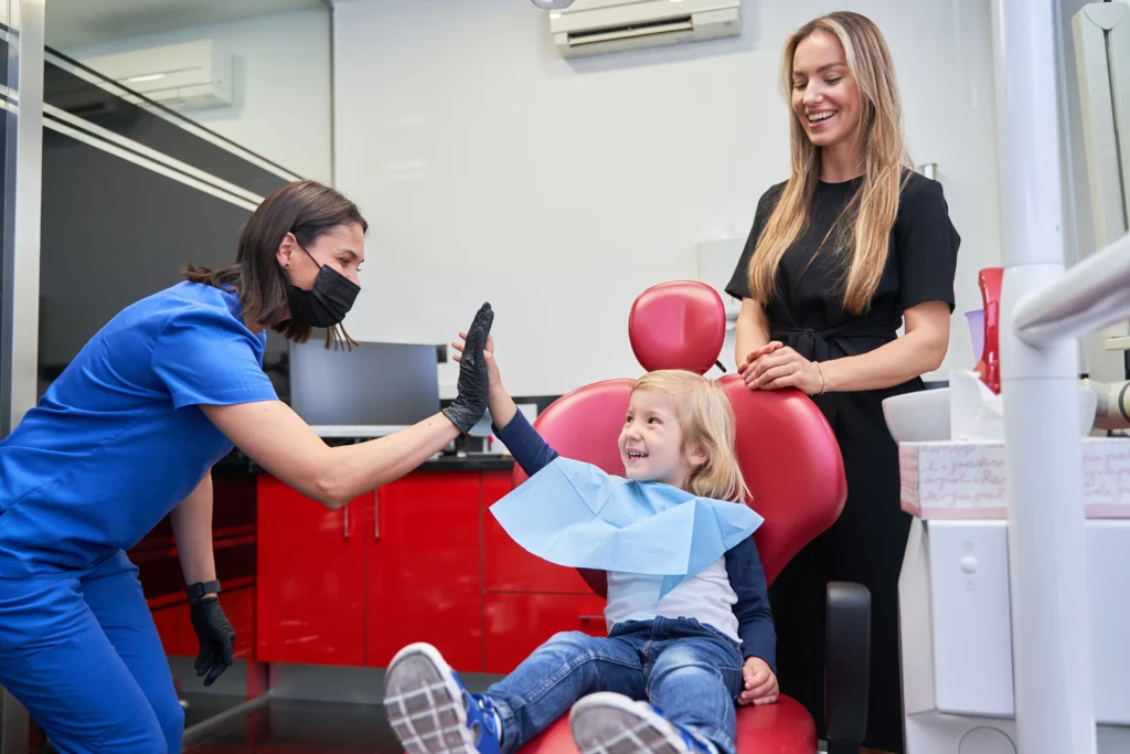 Child smiling during orthodontic consultation in Irvine CA at shining smiles orthodontics