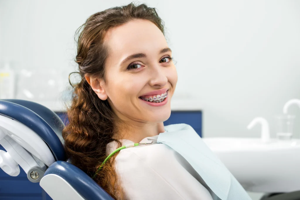 Patient smiling with braces at Irvine orthodontic office